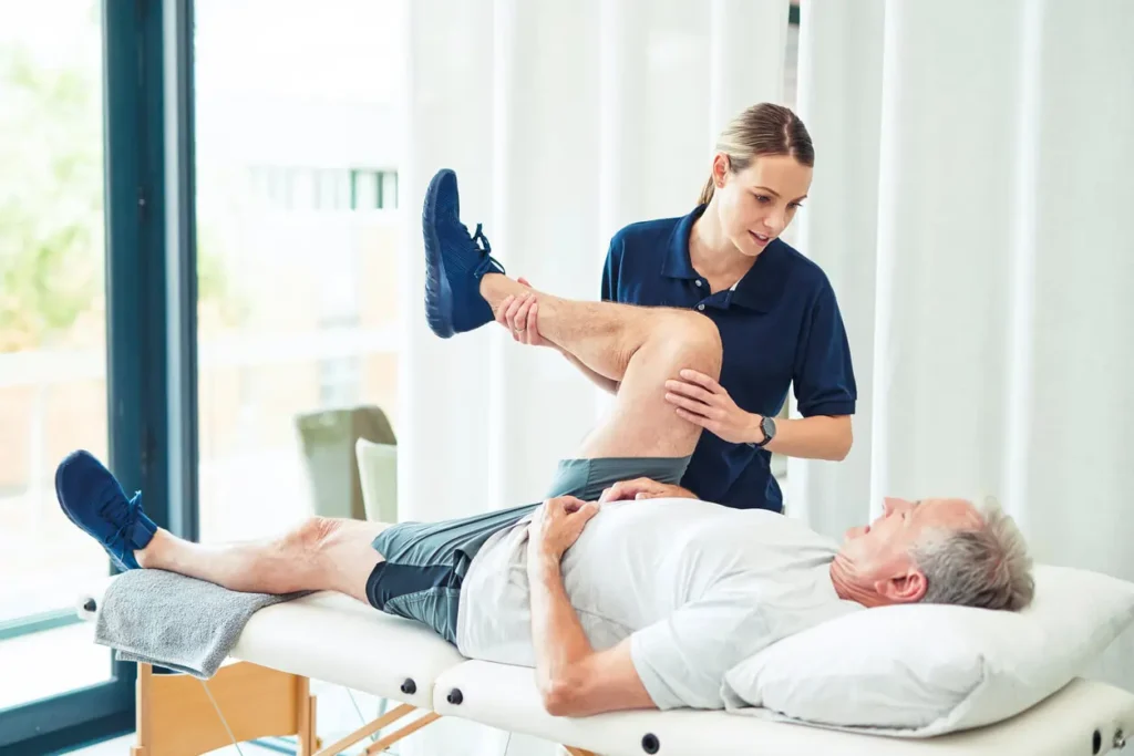 Revitalising Recovery: Effective Rehabilitation Strategies for Muscle Injuries 3 Physiotherapist assisting a patient with muscle recovery exercises Dunstable