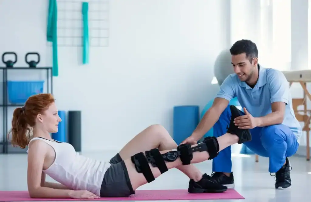 Woman having treatment to help muscle recovery Dunstable after an injury