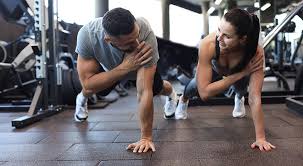 Image of man and woman doing Cardio Dunstable to tone their arms. 